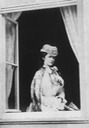 1865 Sisi posing by an open window